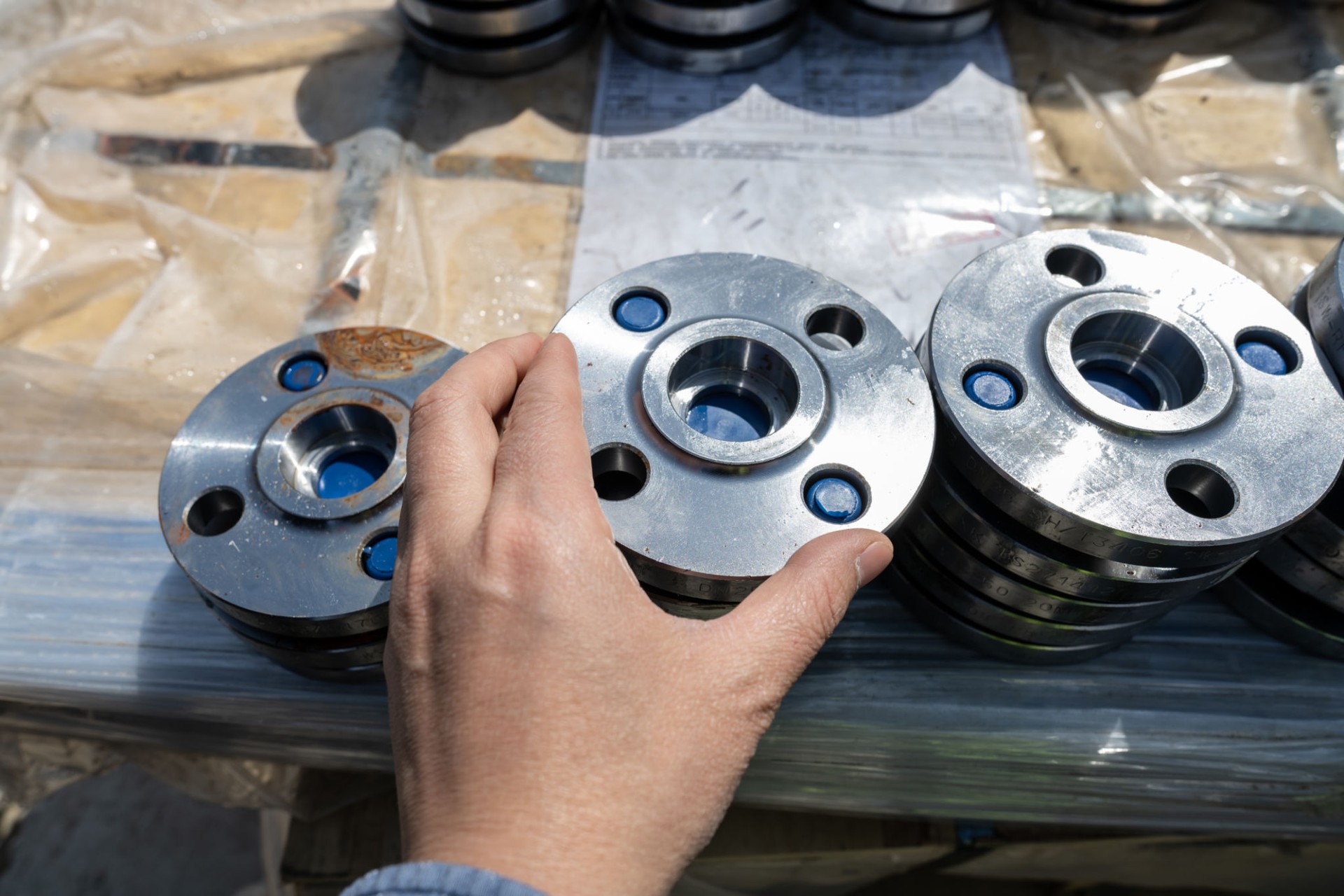 Workers holding mechanical accessories